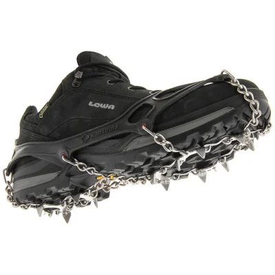 Kahtoola MICROspikes traction stretched over a black hiking shoe, showing the stainless steel spikes and chains