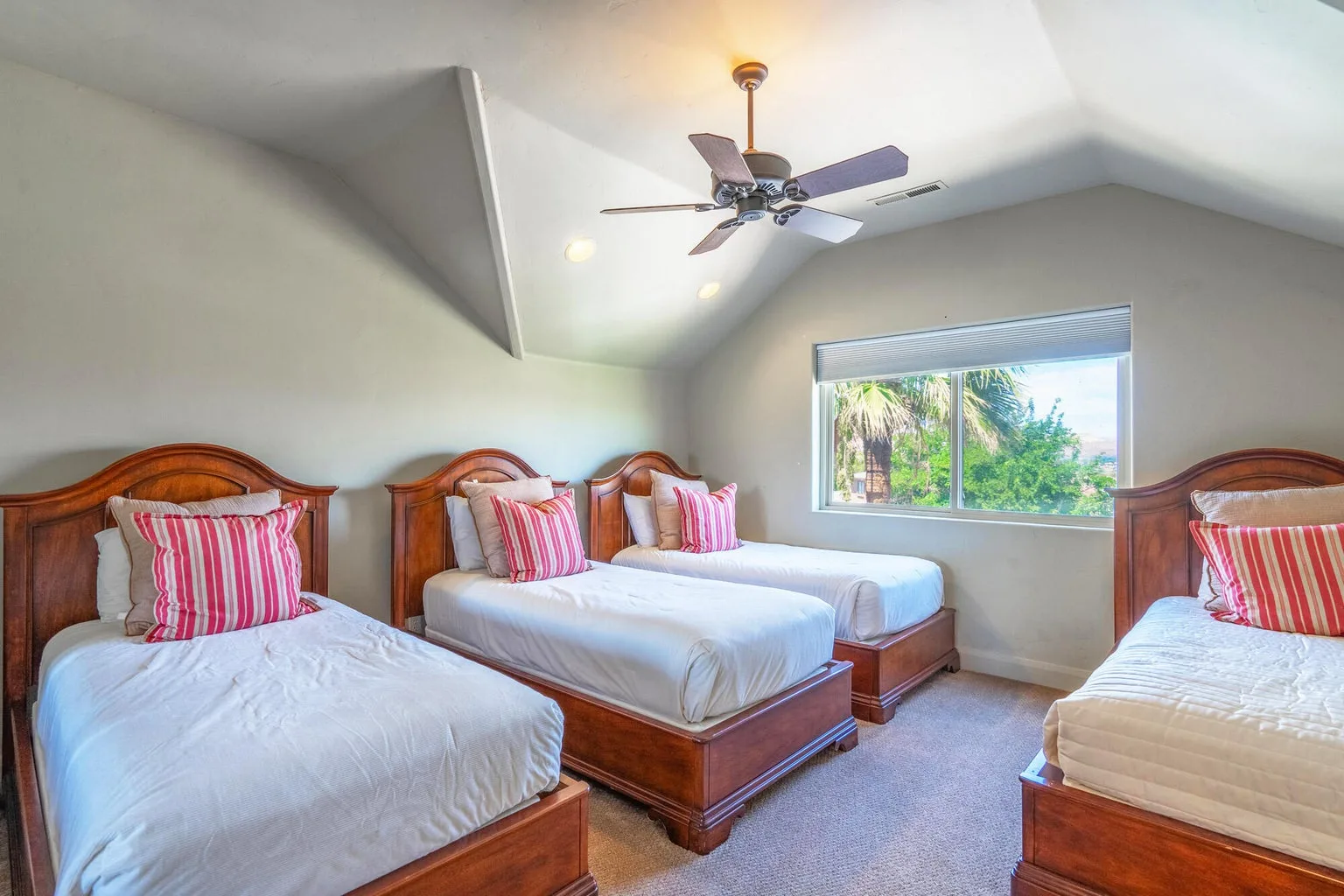Upstairs bedroom configured with four beds, ideal for groups